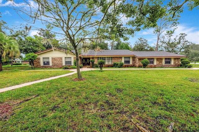 ranch-style home with a front lawn