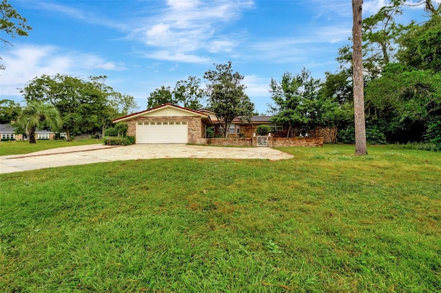 view of front facade with a front yard and a garage