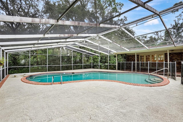 view of pool featuring a patio and a lanai