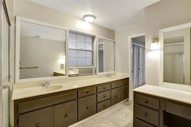 bathroom with tile patterned flooring and vanity