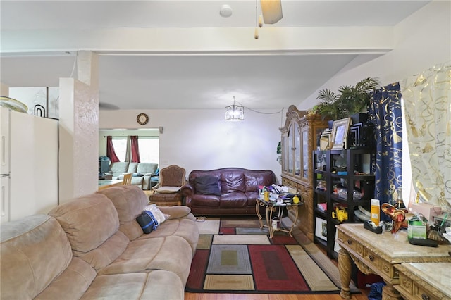 living room featuring wood-type flooring and ceiling fan