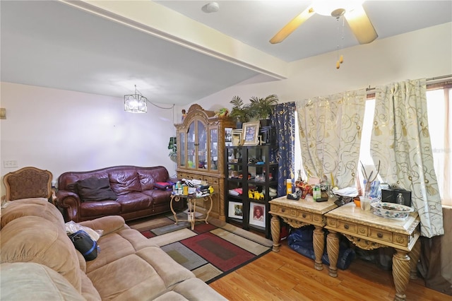 living room with wood-type flooring and ceiling fan