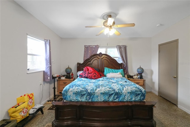 bedroom featuring light colored carpet and ceiling fan