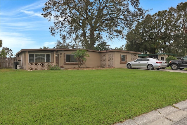 ranch-style house with a front yard