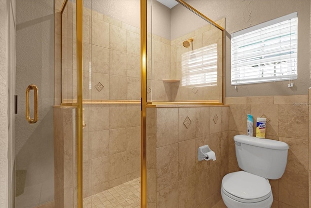 bathroom with toilet and walk in shower