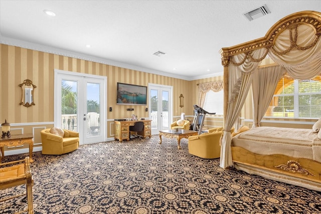 interior space with crown molding, french doors, carpet, and a healthy amount of sunlight