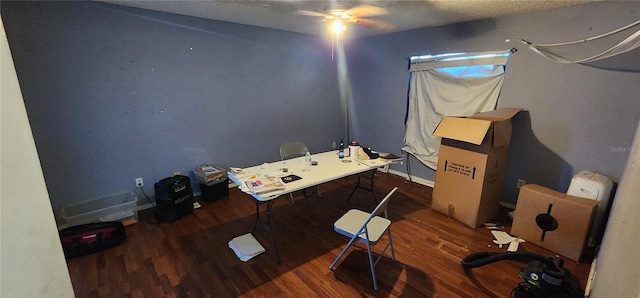 office area with dark hardwood / wood-style floors, ceiling fan, and a textured ceiling