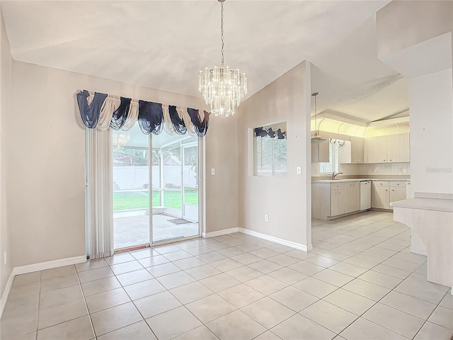 unfurnished dining area with sink, light tile patterned floors, a chandelier, and lofted ceiling