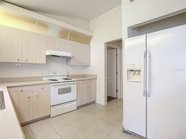 kitchen with light brown cabinets, a textured ceiling, white appliances, decorative backsplash, and light tile patterned floors