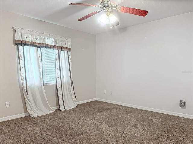 empty room featuring ceiling fan and carpet floors