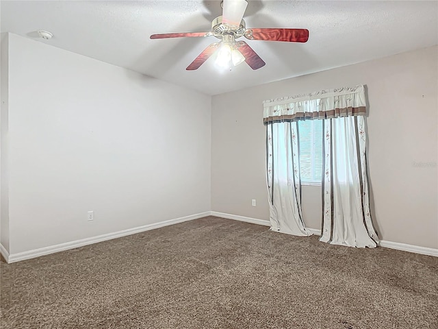 empty room featuring carpet flooring, ceiling fan, and a textured ceiling