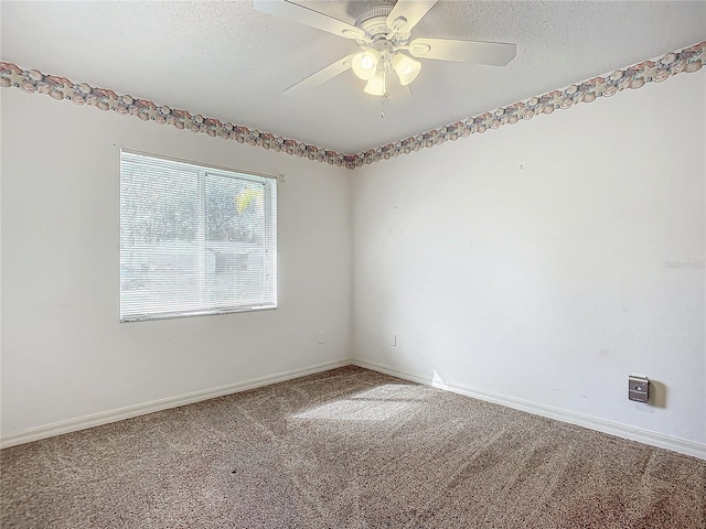 empty room featuring carpet flooring, a textured ceiling, and ceiling fan