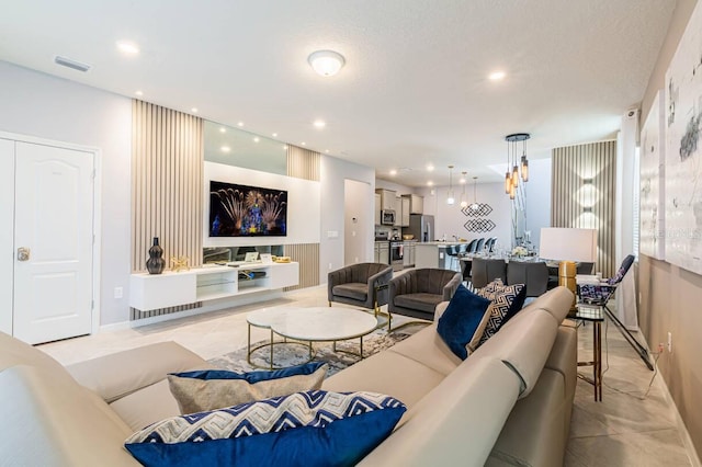 7400 Oakmoss Loop, Davenport, FL 33837 - living area with recessed lighting, baseboards, and light tile patterned floors