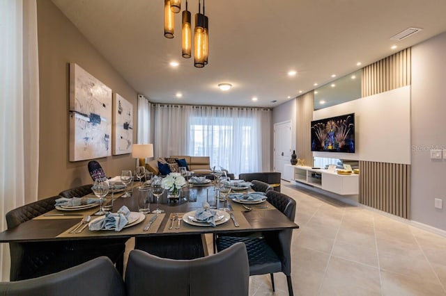 dining area with light tile patterned flooring