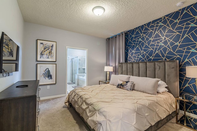 carpeted bedroom with connected bathroom and a textured ceiling