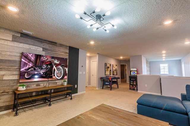 carpeted living room with a textured ceiling and wooden walls