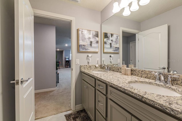 7400 Oakmoss Loop, Davenport, FL 33837 - full bathroom with baseboards, double vanity, and a chandelier