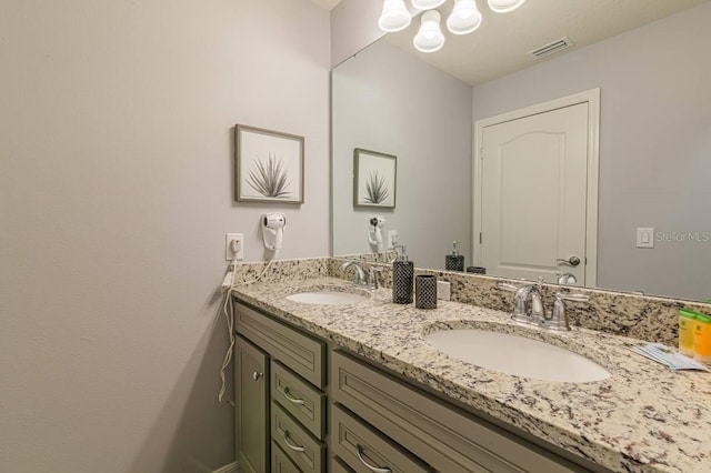 7400 Oakmoss Loop, Davenport, FL 33837 - bathroom with double vanity and a chandelier