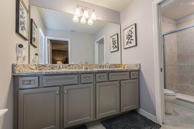 7400 Oakmoss Loop, Davenport, FL 33837 - bathroom with toilet, a stall shower, tile patterned flooring, double vanity, and a chandelier