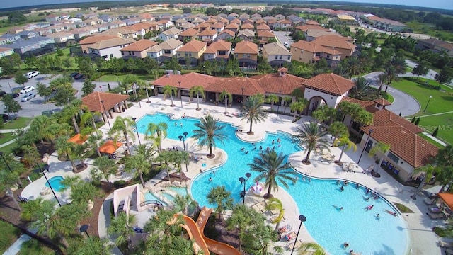 7400 Oakmoss Loop, Davenport, FL 33837 - aerial perspective of suburban area with a pool