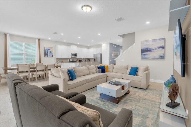 living room featuring light tile patterned flooring