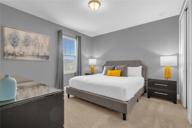 bedroom with light colored carpet