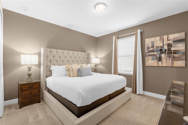 bedroom with light colored carpet