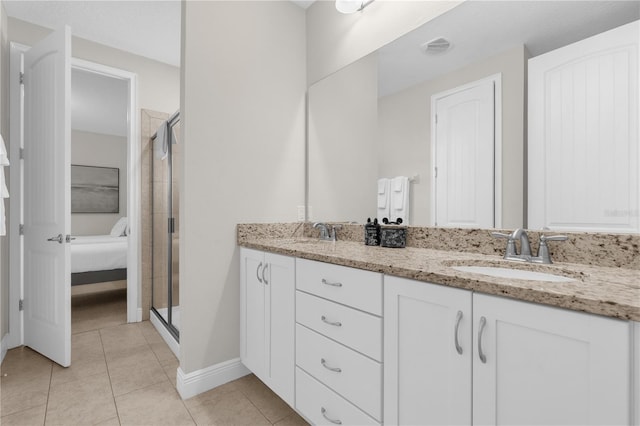 bathroom with vanity, tile patterned floors, and walk in shower