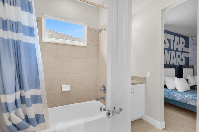 bathroom featuring tile patterned floors, shower / bath combo, and vanity