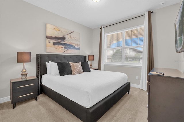 bedroom featuring light carpet