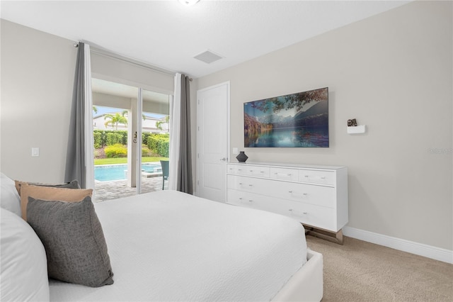 carpeted bedroom featuring access to outside