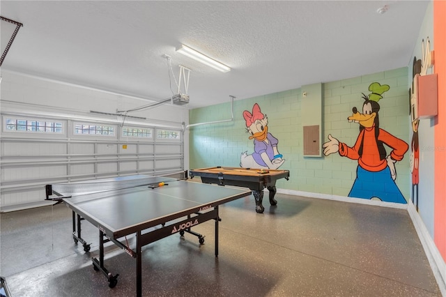 recreation room featuring electric panel, a textured ceiling, and pool table