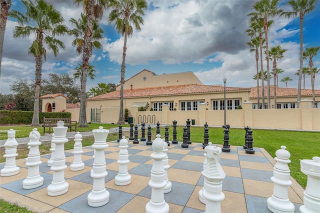 view of community featuring a lawn and a patio area