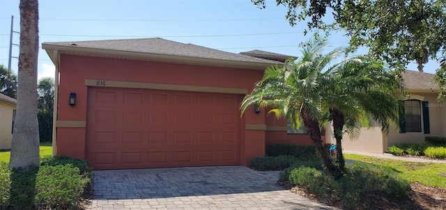 836 Grand Canal Dr, Kissimmee, FL 34759 - garage featuring decorative driveway