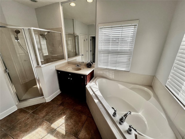 bathroom featuring tile patterned flooring, vanity, and independent shower and bath