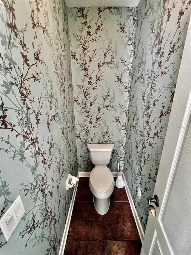 bathroom featuring tile patterned flooring and toilet