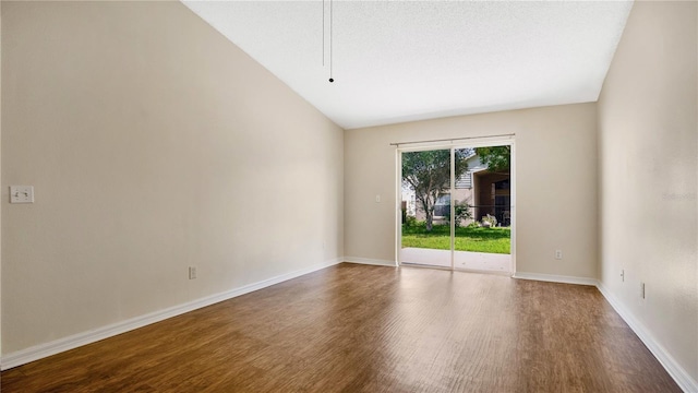 unfurnished room with wood-type flooring, a textured ceiling, and vaulted ceiling