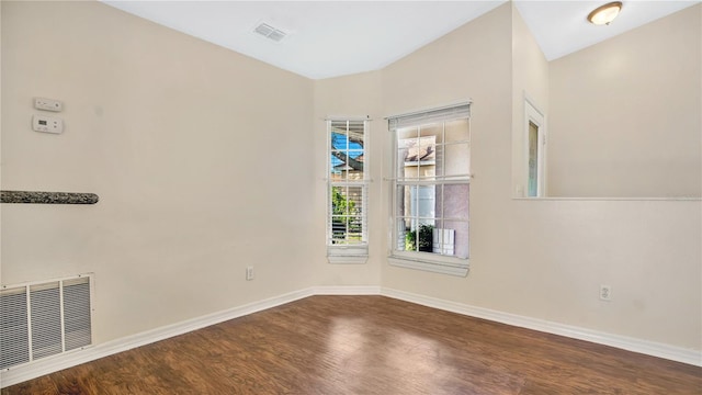 unfurnished room with wood-type flooring