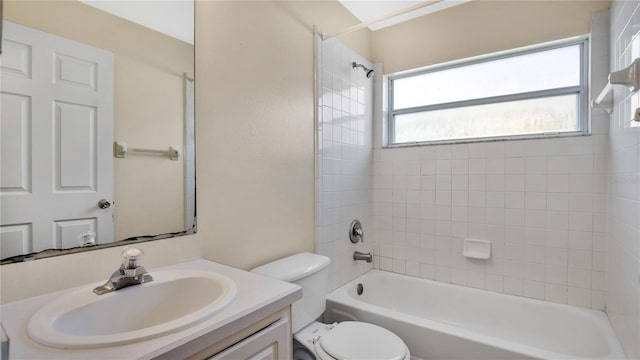 full bathroom featuring toilet, vanity, and tiled shower / bath combo