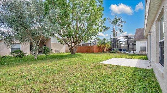 view of yard with a patio area and a lanai