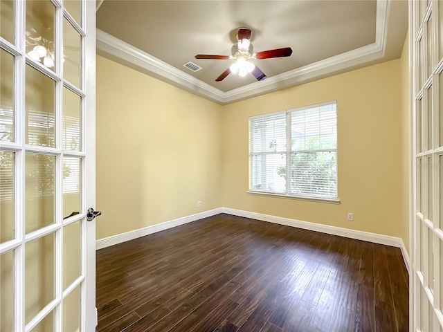 spare room featuring french doors, dark hardwood / wood-style flooring, and ornamental molding