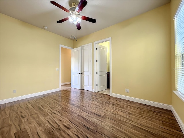 unfurnished bedroom with ceiling fan and hardwood / wood-style flooring