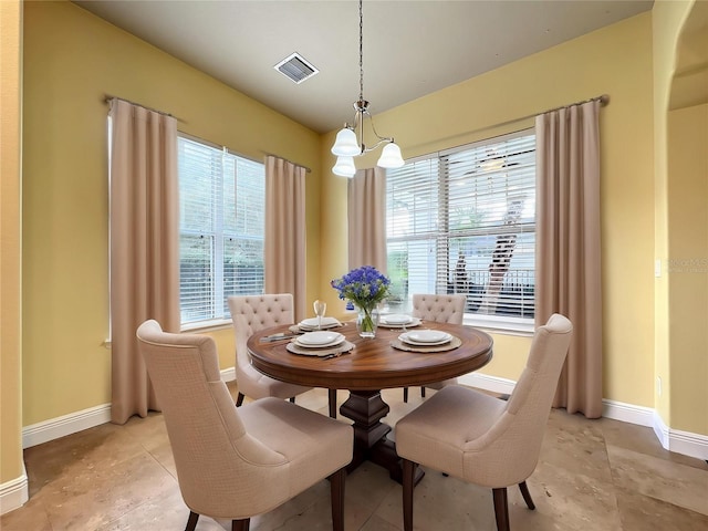 7508 Lake Albert Dr, Windermere, FL 34786 - dining space featuring light tile patterned floors, visible vents, and baseboards