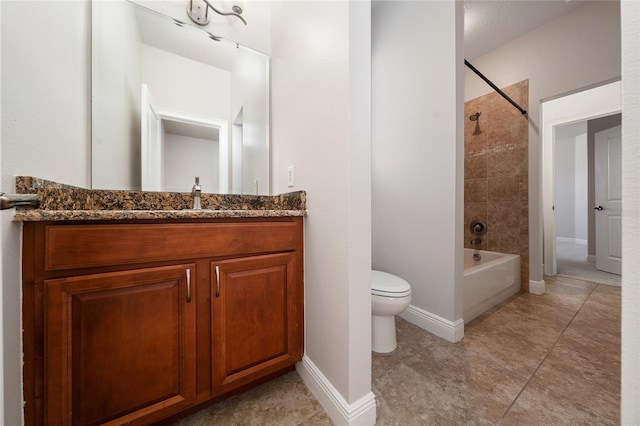 7508 Lake Albert Dr, Windermere, FL 34786 - full bathroom featuring washtub / shower combination, vanity, toilet, baseboards, and tile patterned flooring