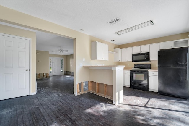 kitchen featuring ceiling fan, black appliances, dark hardwood / wood-style floors, white cabinetry, and a breakfast bar area