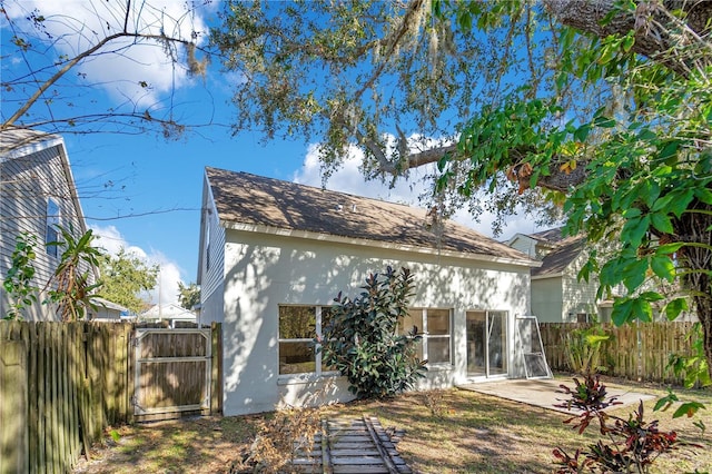 rear view of property featuring a patio area