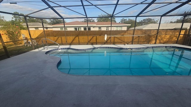 view of pool with a lanai