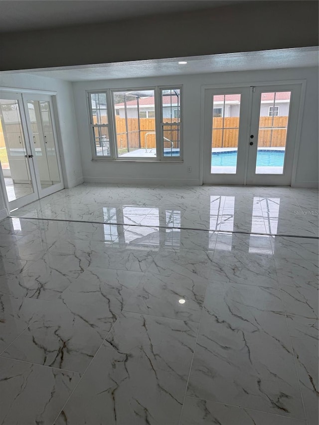 empty room featuring french doors