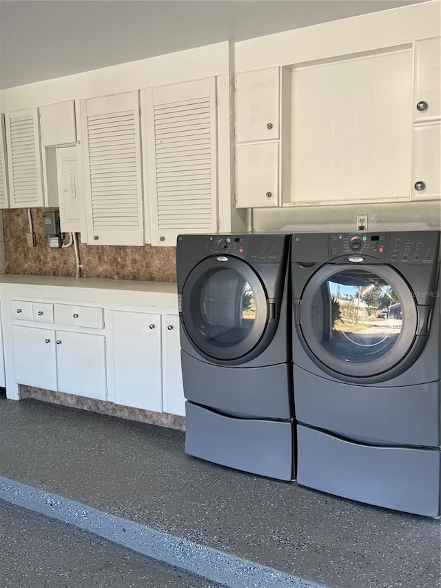 laundry area with cabinets and independent washer and dryer