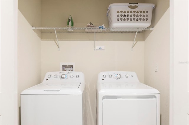 laundry area with washing machine and dryer